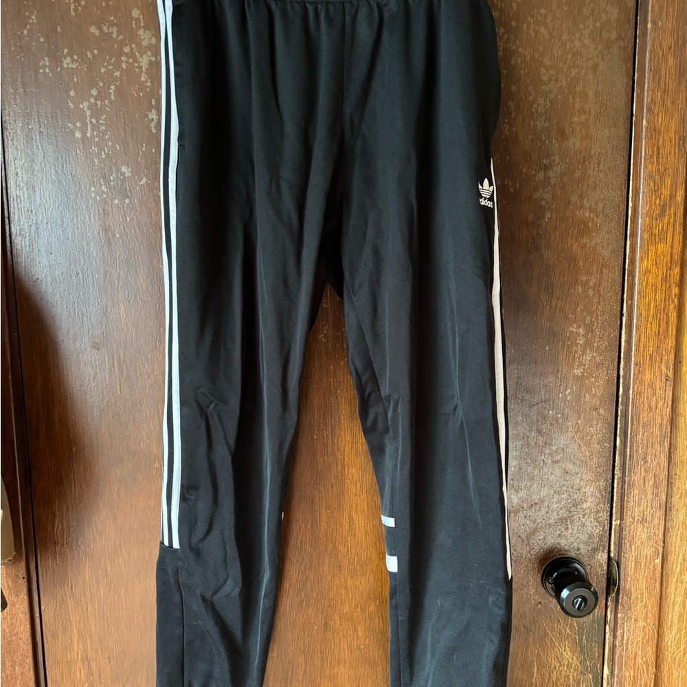 Adidas Black Joggers with Iconic Stripes